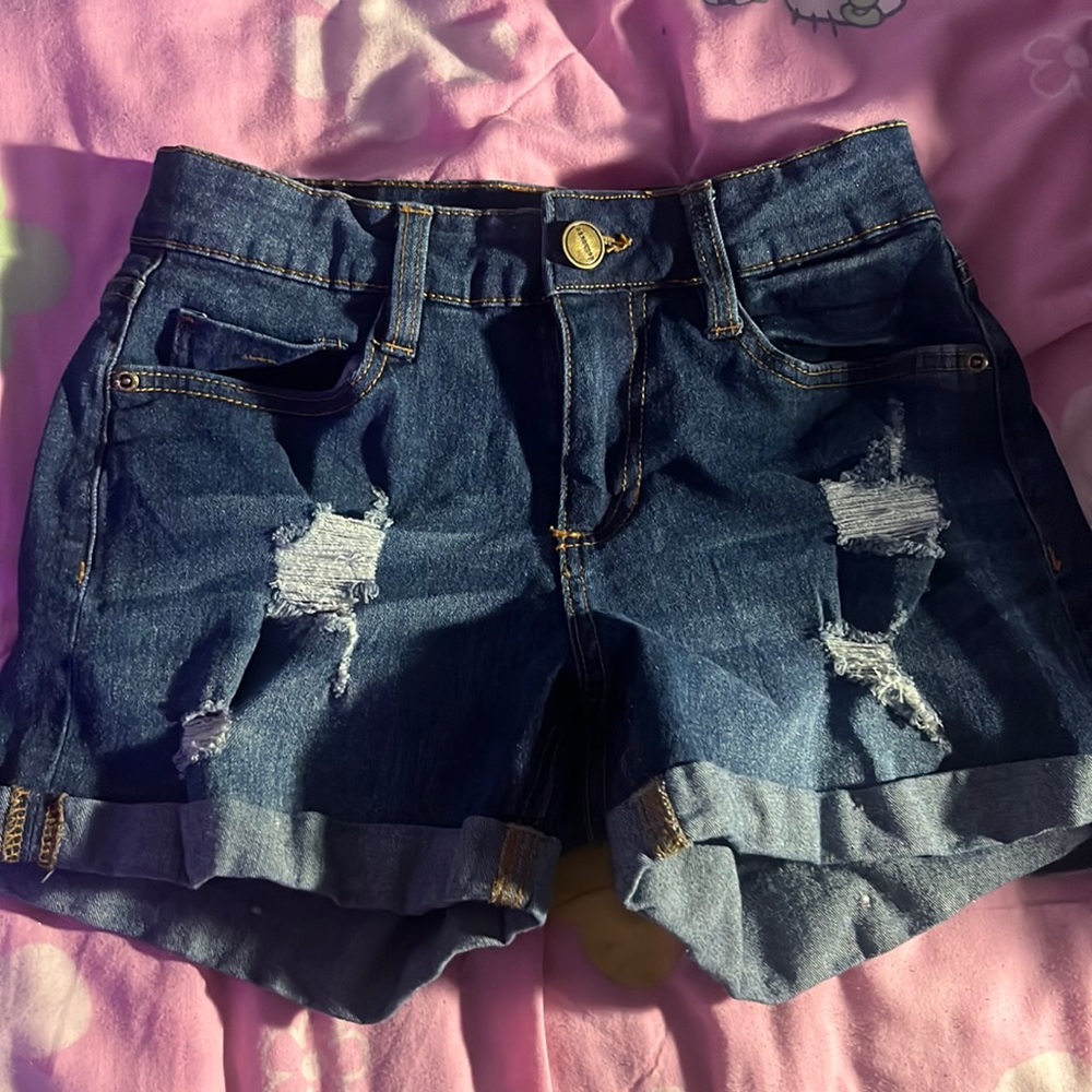 Blue shorts, defines curves.